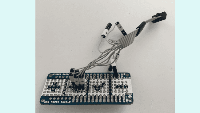 A MKR Proto Shield and 6 2.54mm straight male headers can be used to access the exposed pads of the MKR WiFi 1010 board.